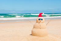 a snowman on the beach 